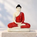Styled product image of Ivory Buddha in Red Robe