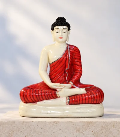 Styled product image of Ivory Buddha in Red Robe