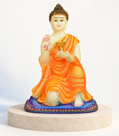 Styled product image of Orange Buddha Candle Holder