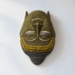 Styled product image of Golden Buddha Face Wall Accent