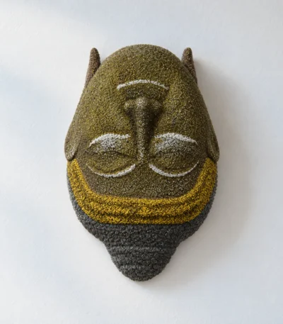 Styled product image of Golden Buddha Face Wall Accent