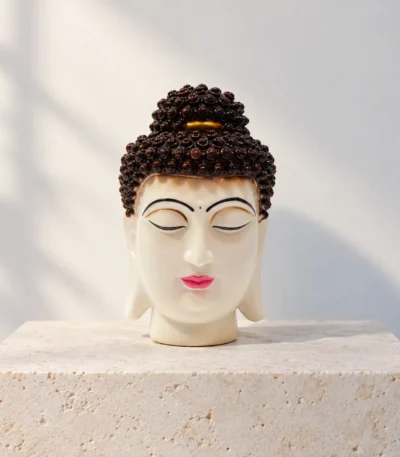 Styled product image of White Buddha Face with Brown Hair