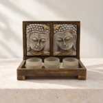 Styled product image of Twin Buddha Face Tealight Holder